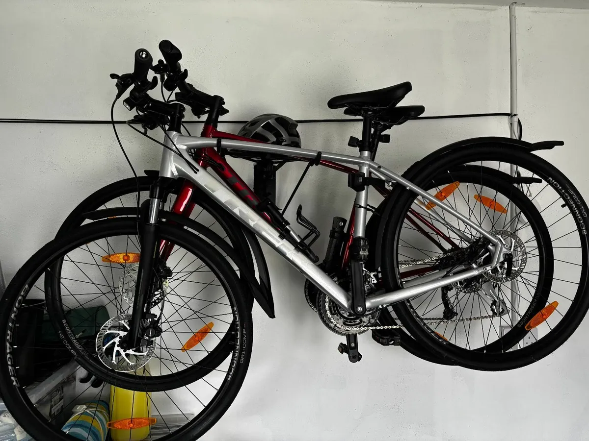 2 FX TREK Bicycles with helmets and locks