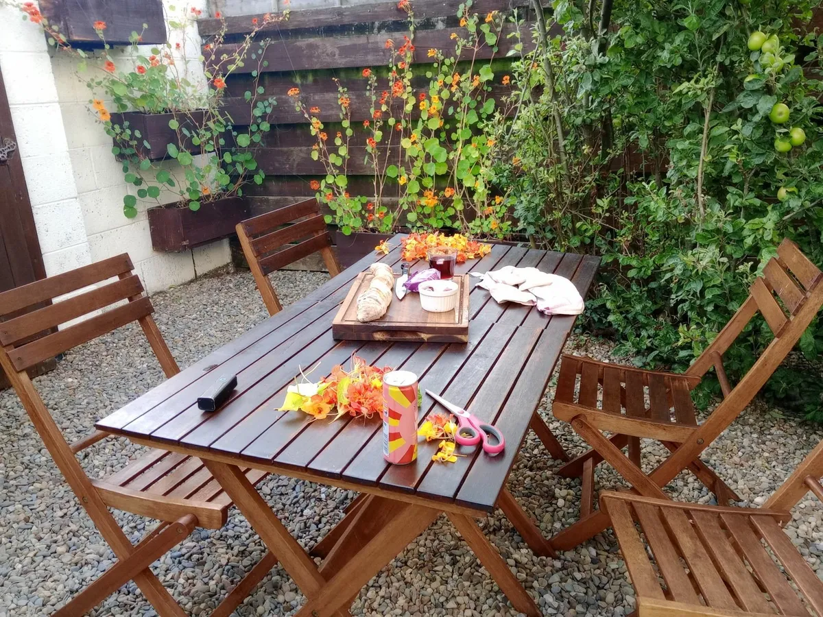 Solid Acacia All Year Hardwood Garden Table + Four - Image 1
