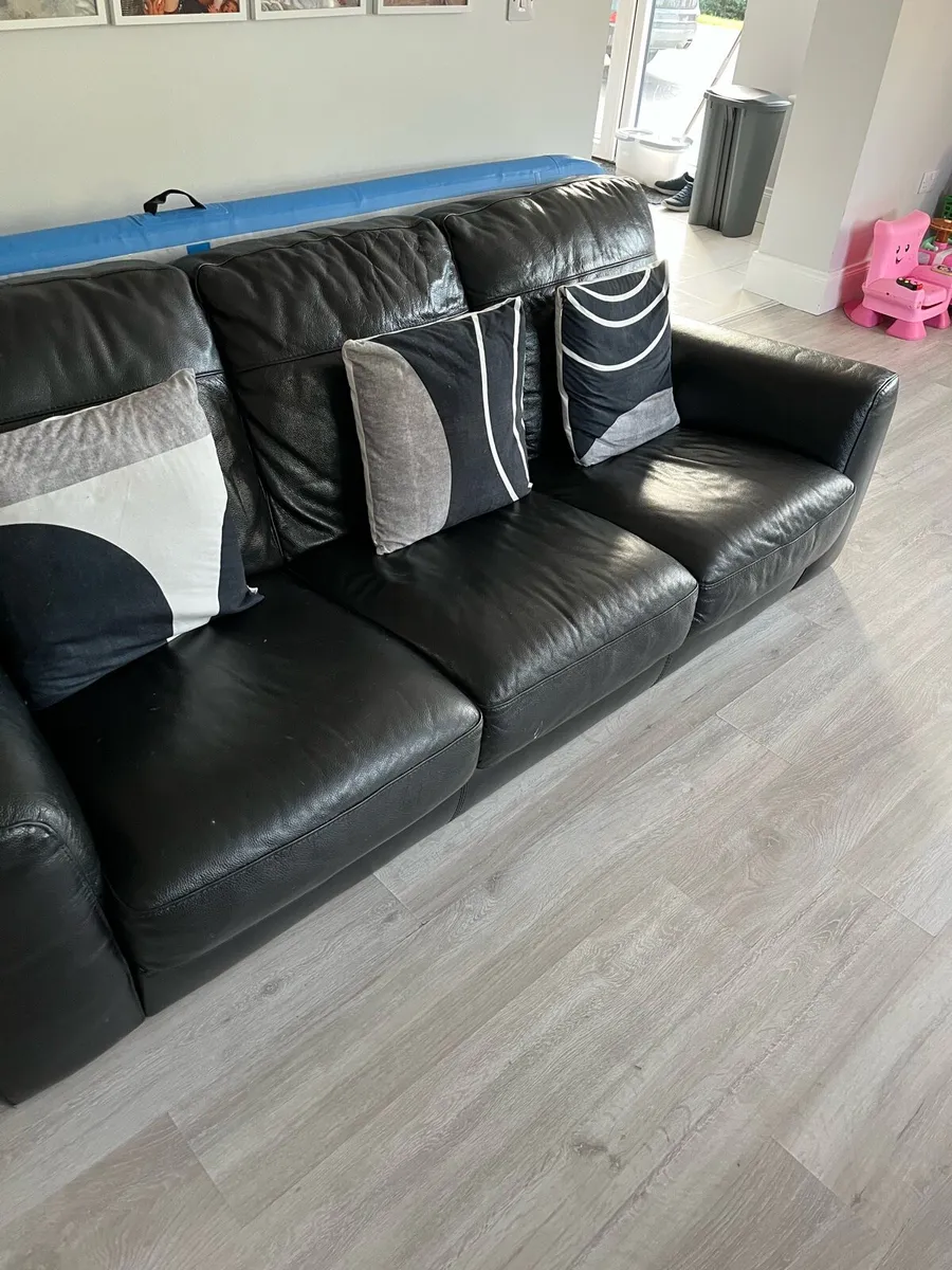 Black leather sofa from Harvey Norman’s 3seater - Image 2