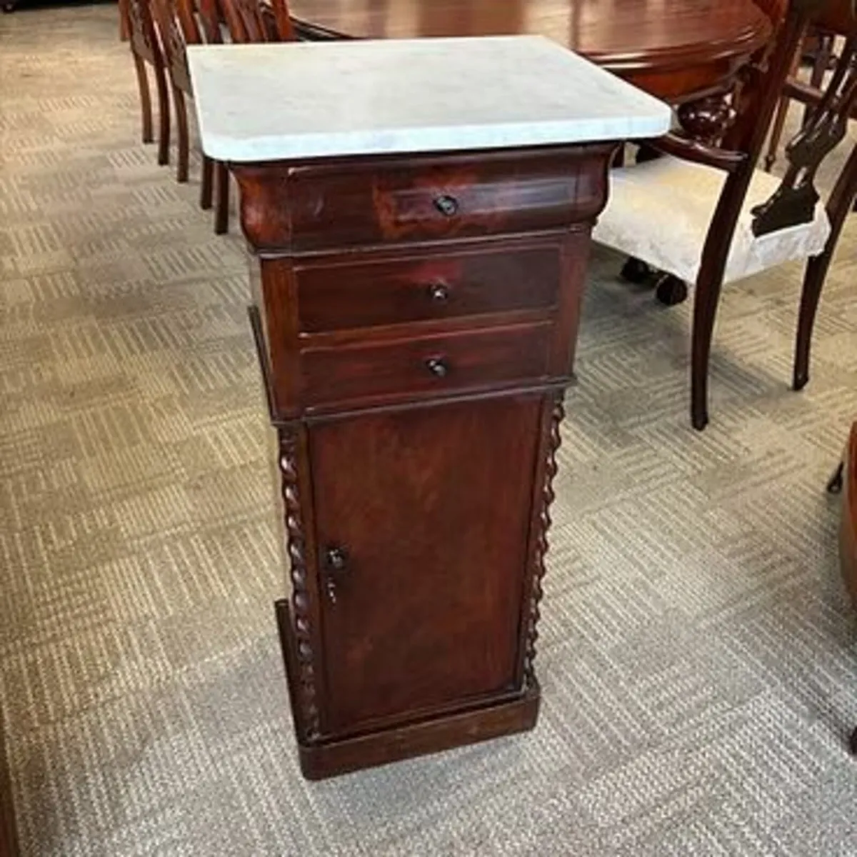 Early 19th-century mahogany burl marble top chest