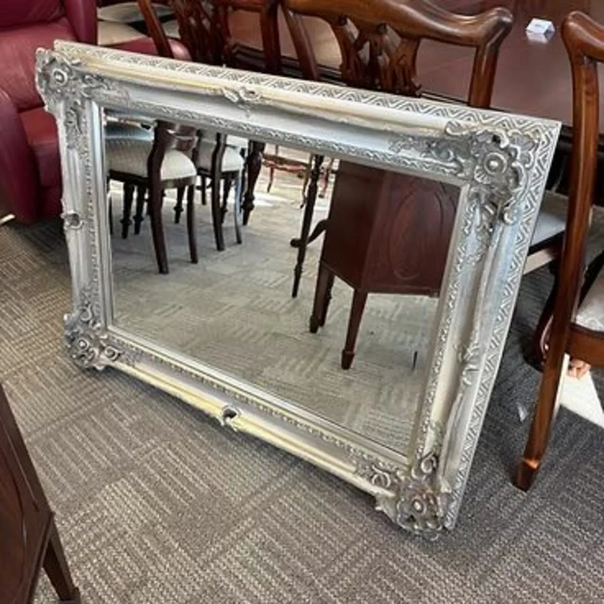 Ornate silver wall mirror