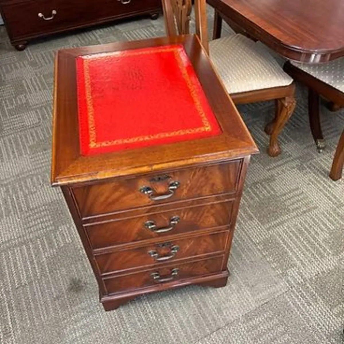 Beautiful mahogany red leather top filing cabinet.
