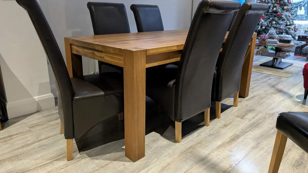 Solid wood dining table and chairs - Image 1