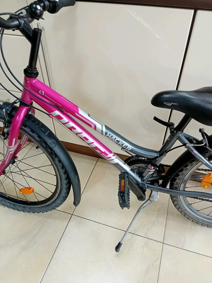GIRLS BIKE 24 INCH WHEELS AS NEW - Image 1