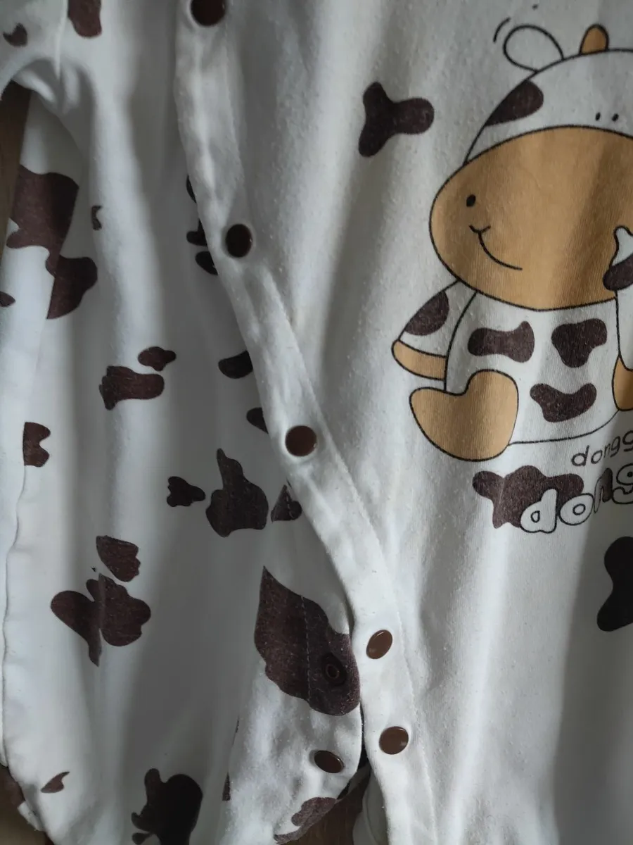 Cow style  baby playsuit fits up to 18 years - Image 1