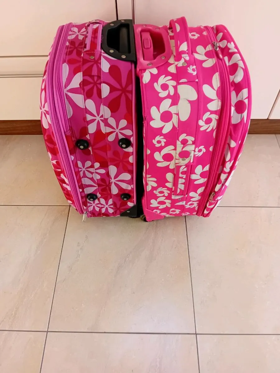 2 LARGE PINK SUITCASES