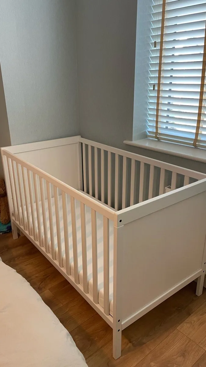 IKEA baby cot and mattress, bed linen - Image 1