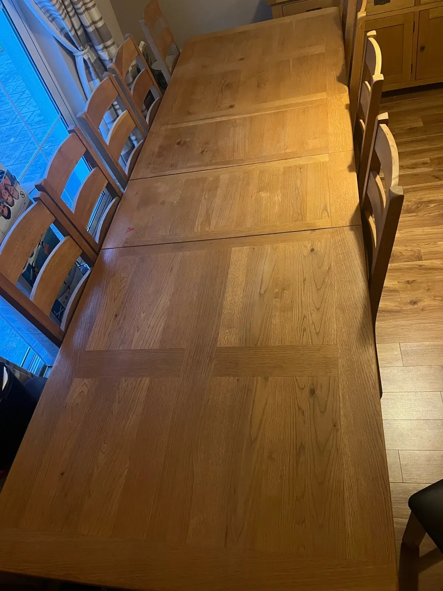 Solid oak dining table, 10 chairs and sideboard - Image 1