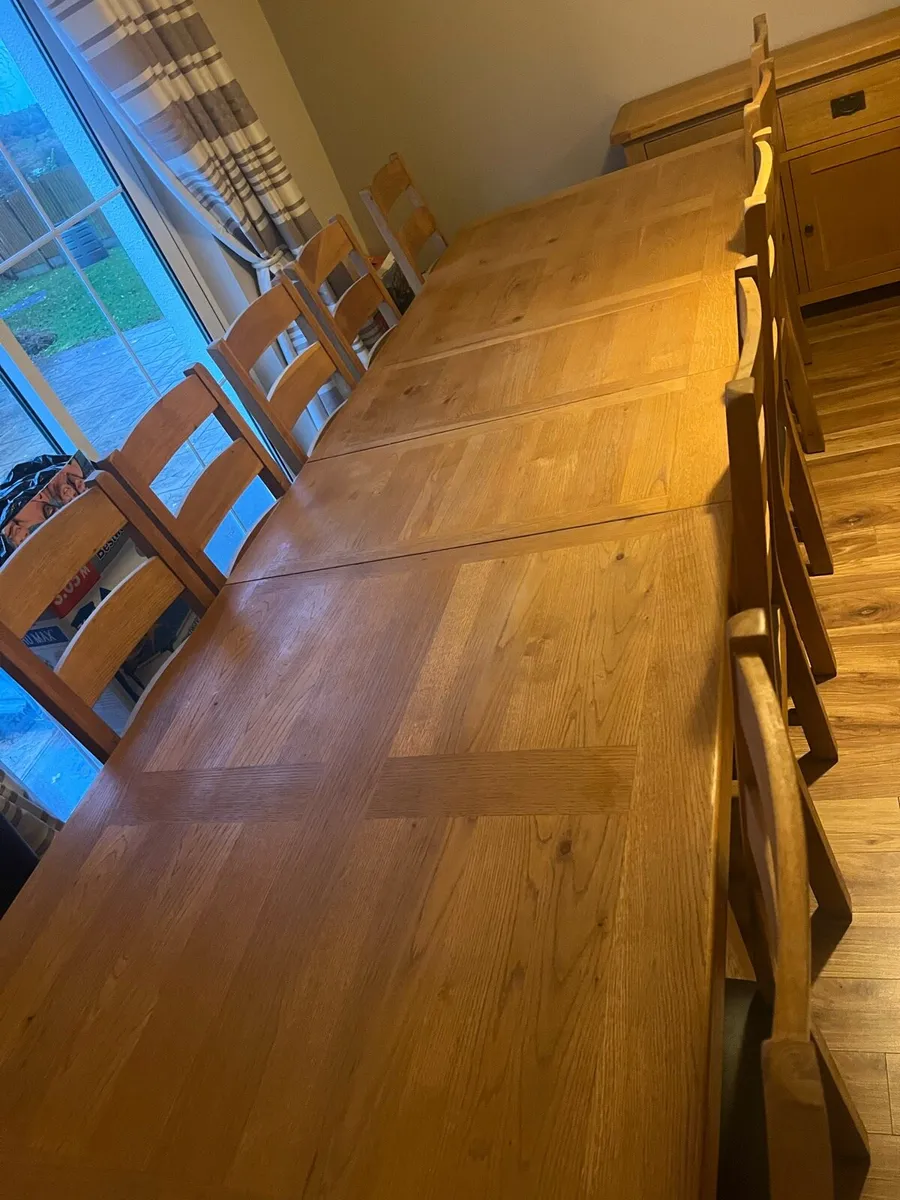 Solid oak dining table, 10 chairs and sideboard - Image 2