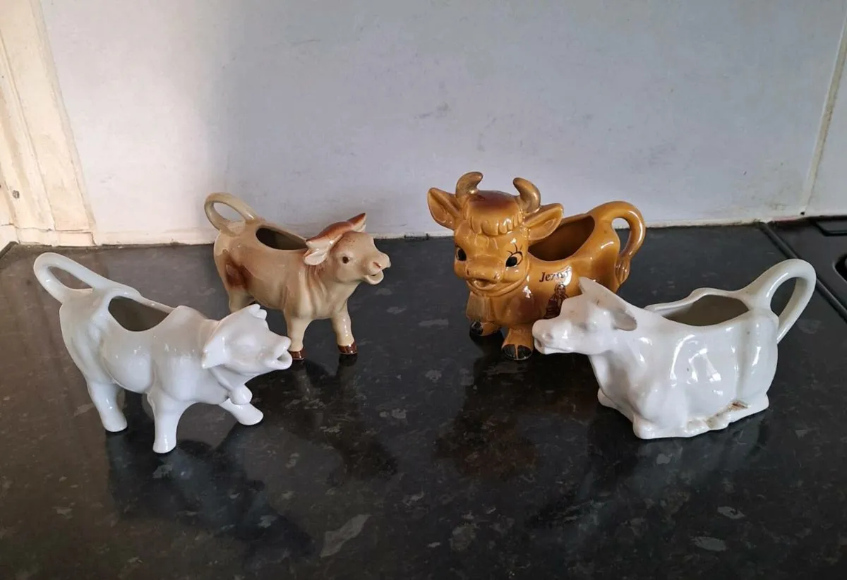Four vintage creamers