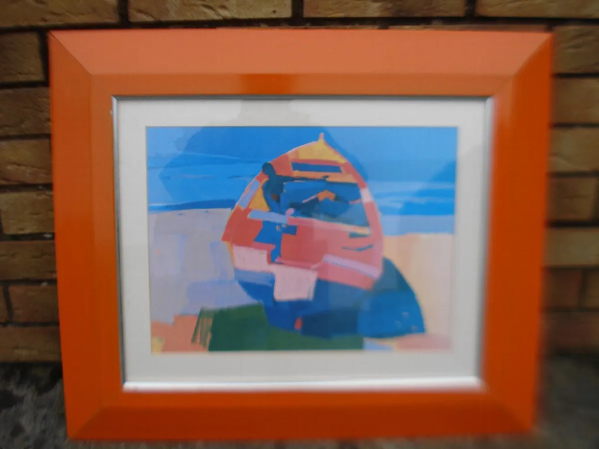 LARGE GLASS FRAMED PAINT OF BEACHED ROWING BOAT. - Image 1