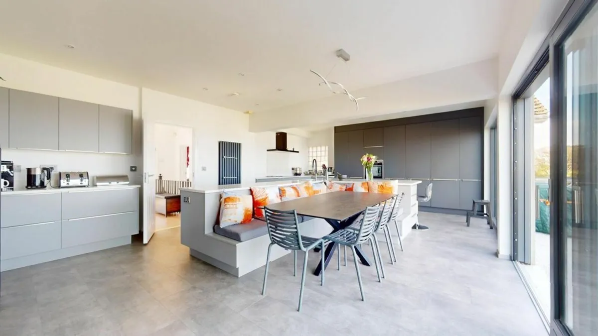 Contemporary Kitchen with Integrated Dining Area - Image 1