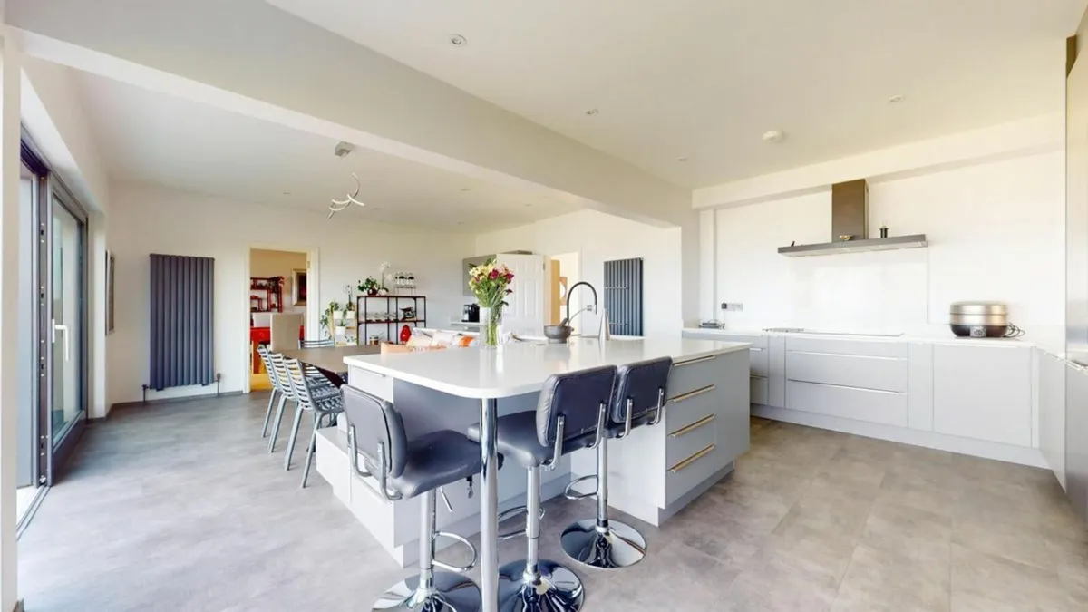 Contemporary Kitchen with Integrated Dining Area - Image 2