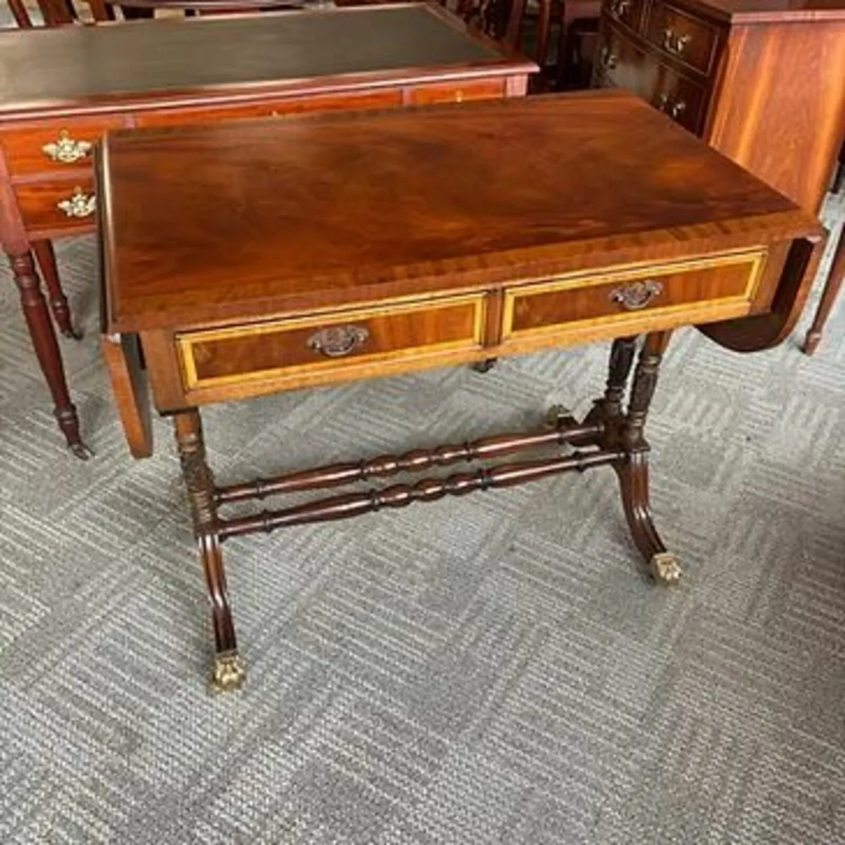 Beautiful mahogany drop leaf writing table. Swipe