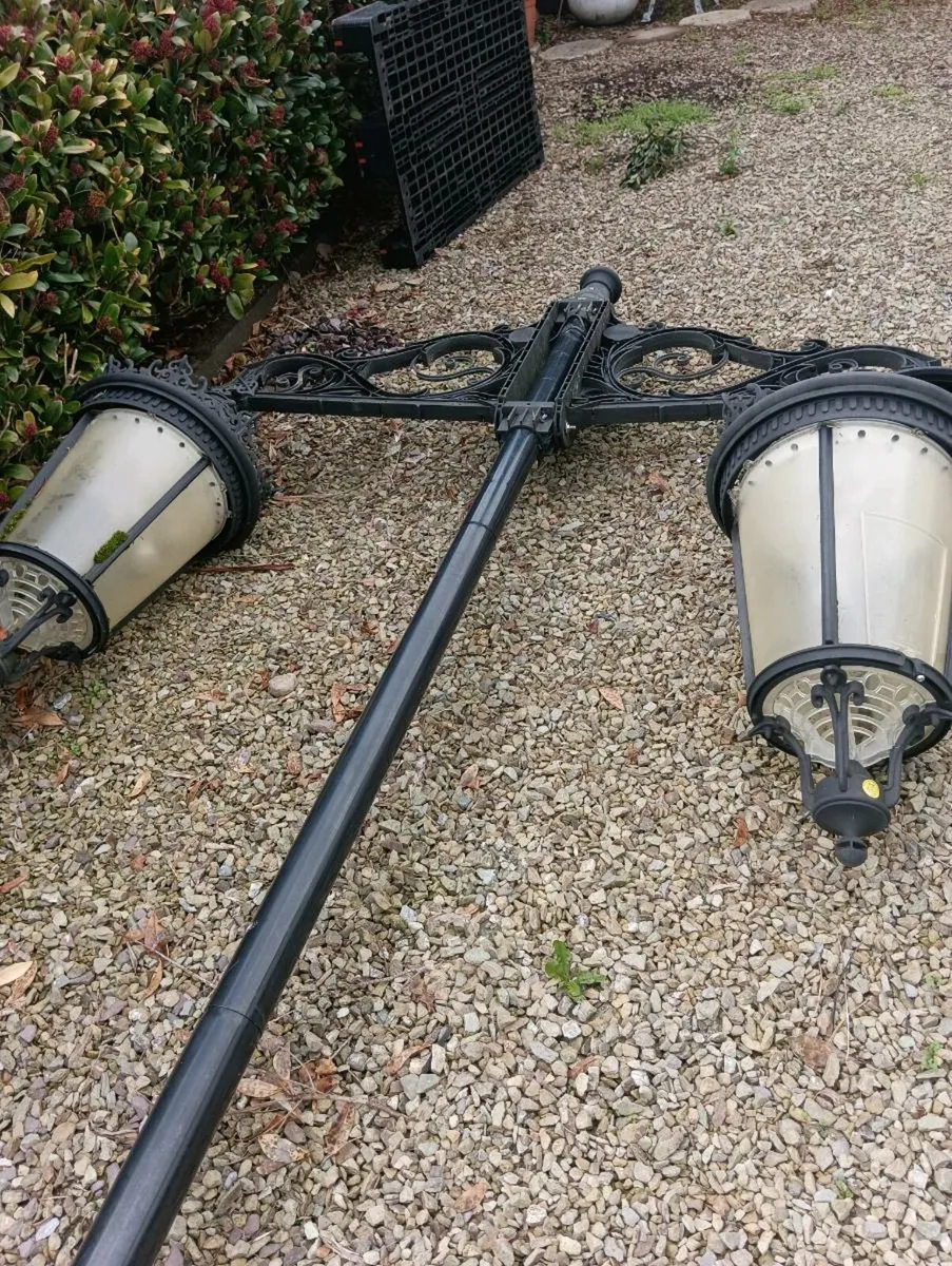 Vintage outdoor lights on steel poles - Image 1