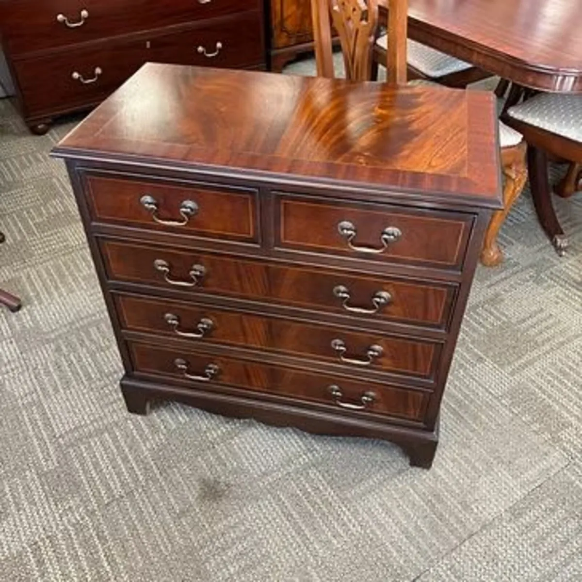 Mahogany flamed chest of drawers. Enclosed with fi
