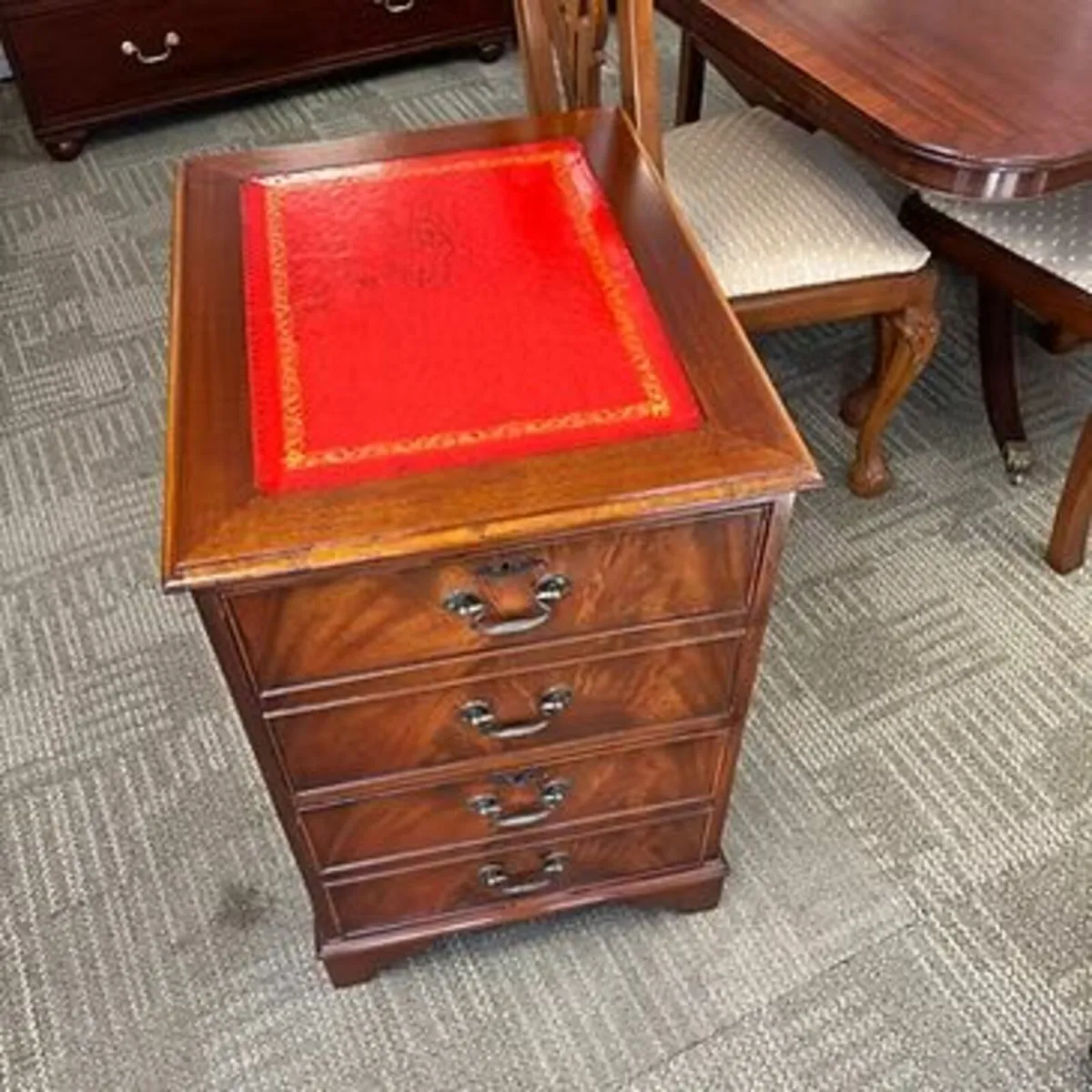 Beautiful mahogany red leather top filing cabinet.
