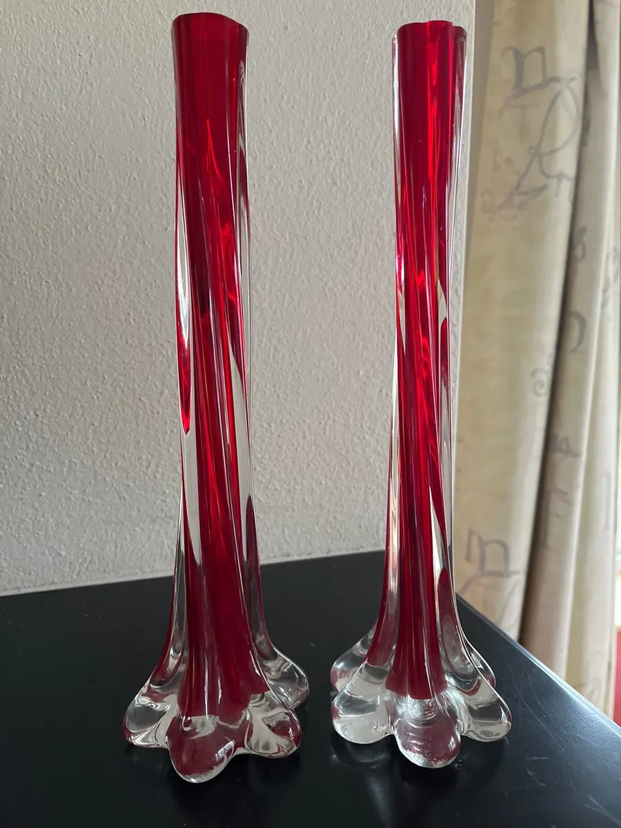 Two red candle stick holders