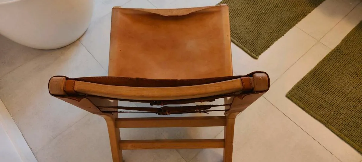 A bold and striking leather and solid wood accent - Image 1