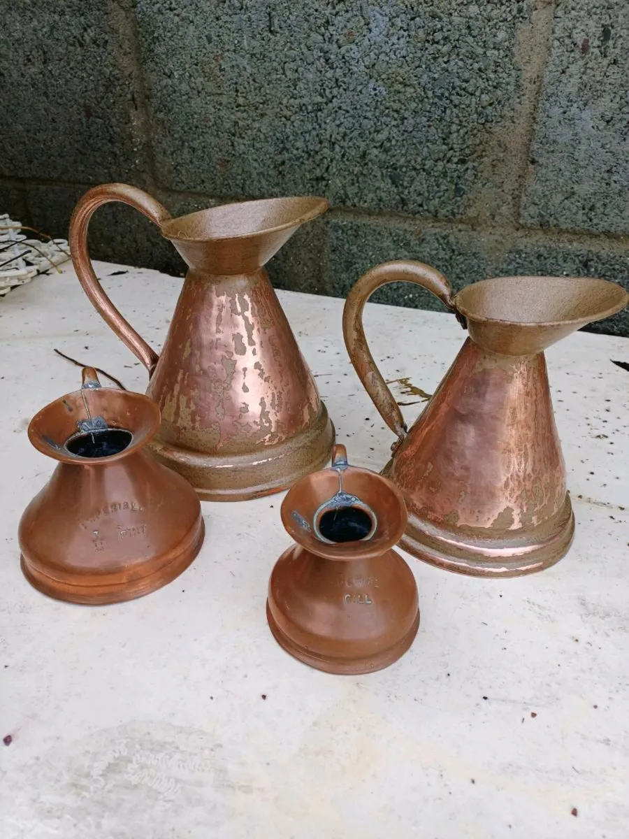 Antique Graduated Copper Jugs - Image 1