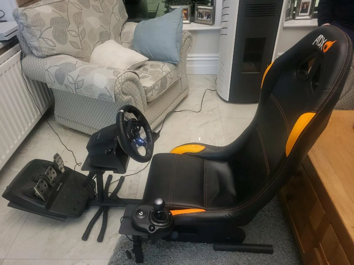 Gaming chair and logitech steering wheel - Image 1