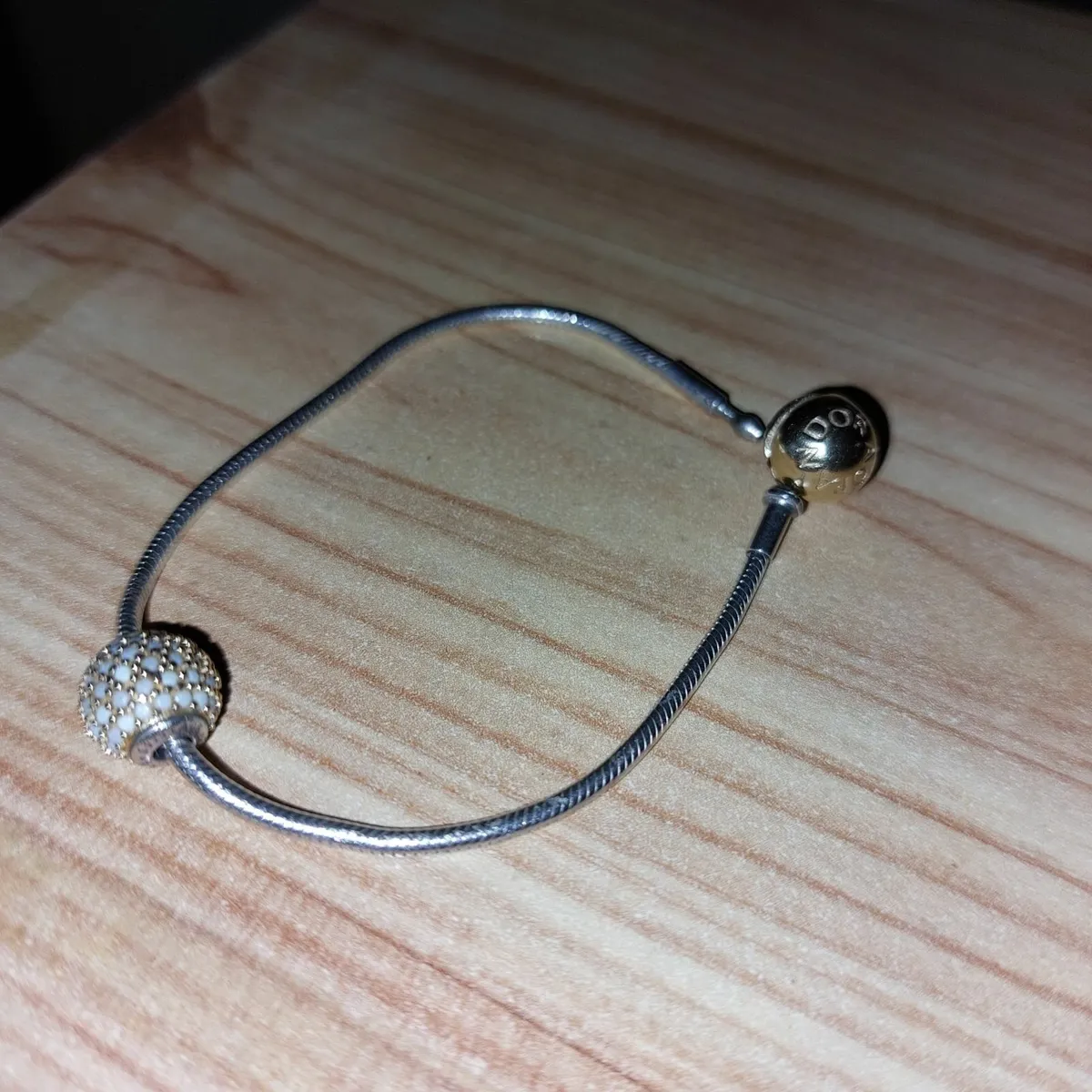 Pandora Essence bracelet with charm - Image 1