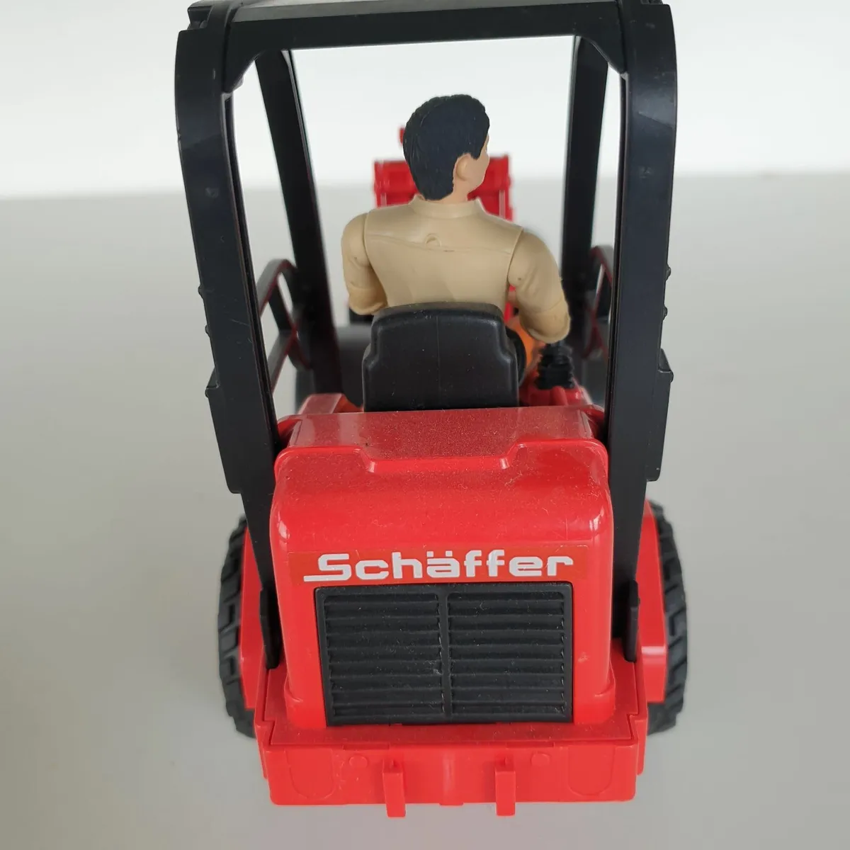 Bruder schaffer loader with driver & bale - Image 4