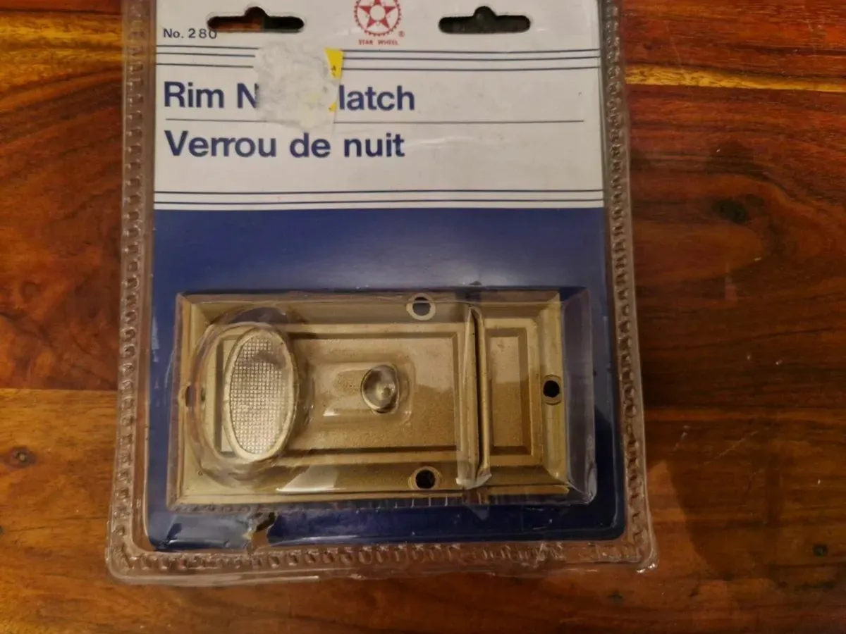 New and Sealed Rim Night Latch Door Lock - Image 1