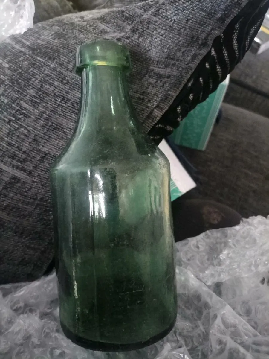 VINTAGE.. FAT BUG BOTTLE... GLASS GREEN .. D - Image 1