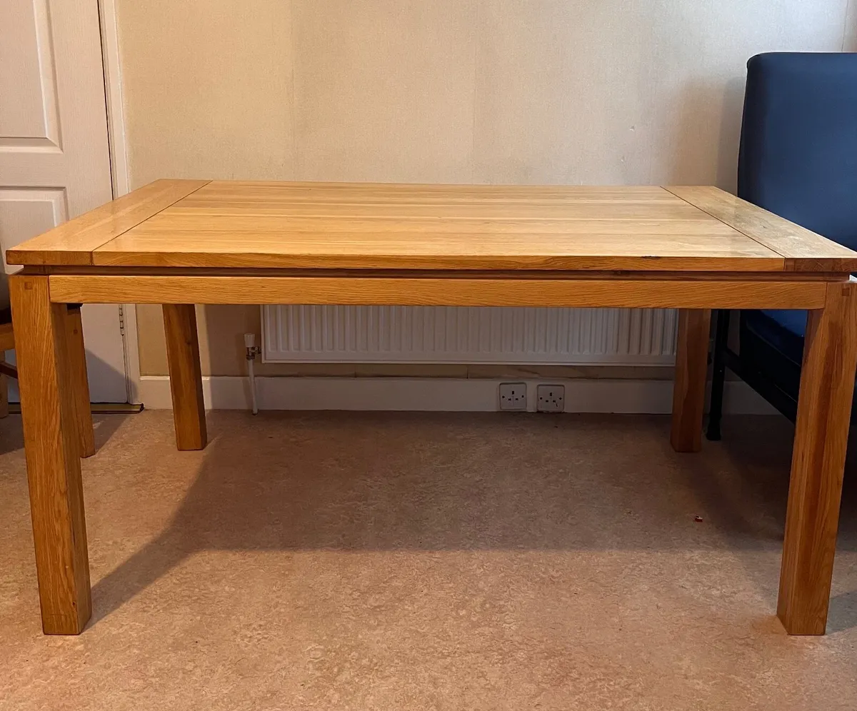 Solid wood dining table - Image 1