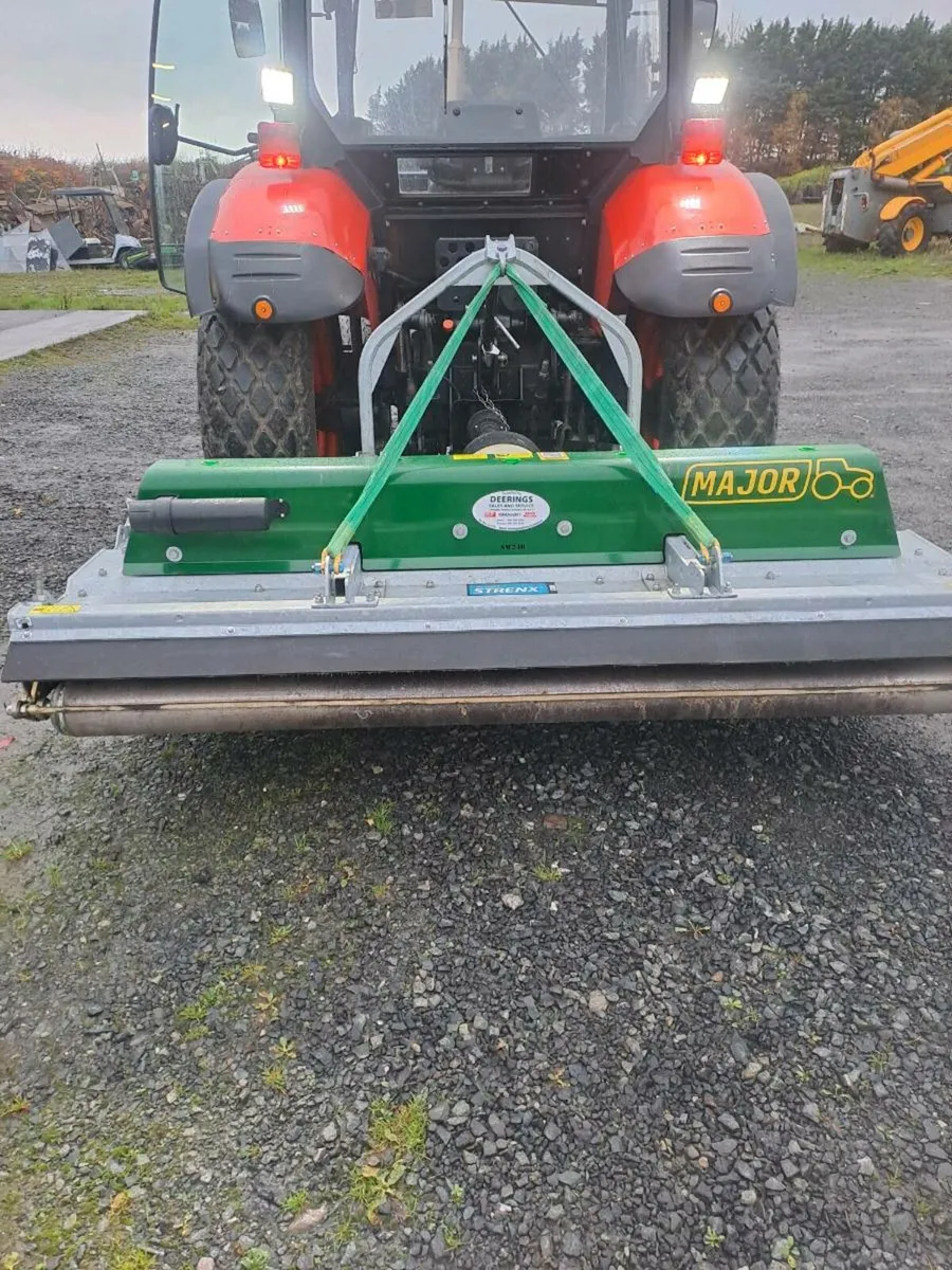 Major mower mulching. - Image 1