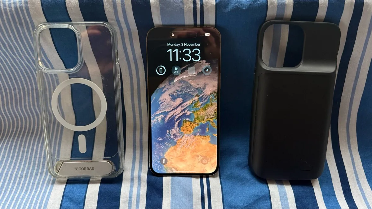 Gold iPhone 14 Pro Max with Charging Cases - Image 1