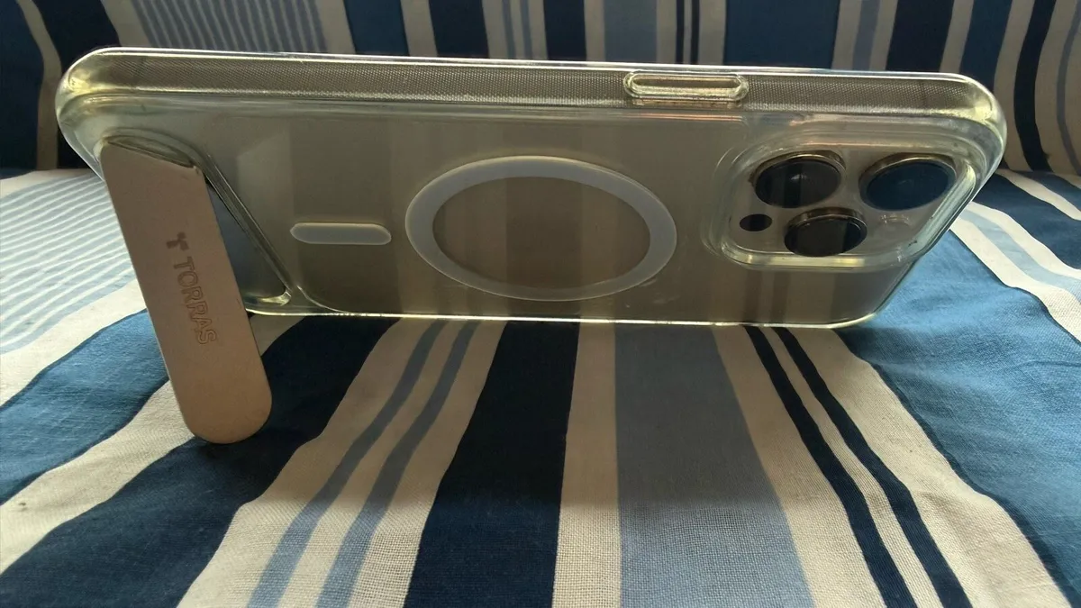 Gold iPhone 14 Pro Max with Charging Cases - Image 3