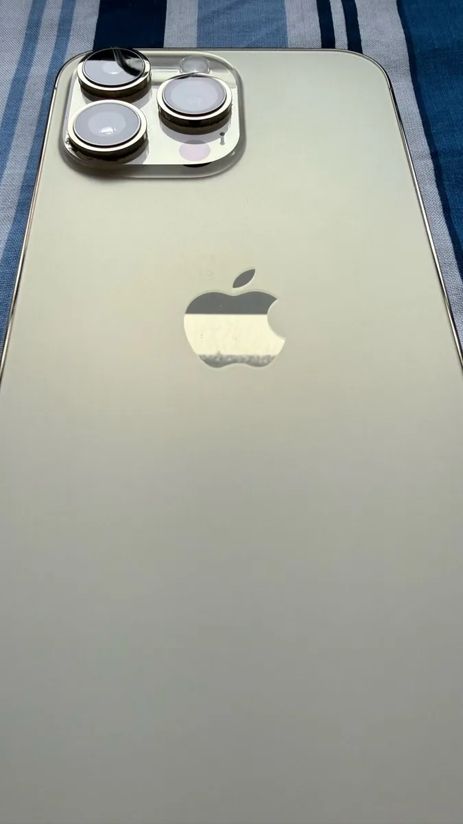 Gold iPhone 14 Pro Max with Charging Cases - Image 4
