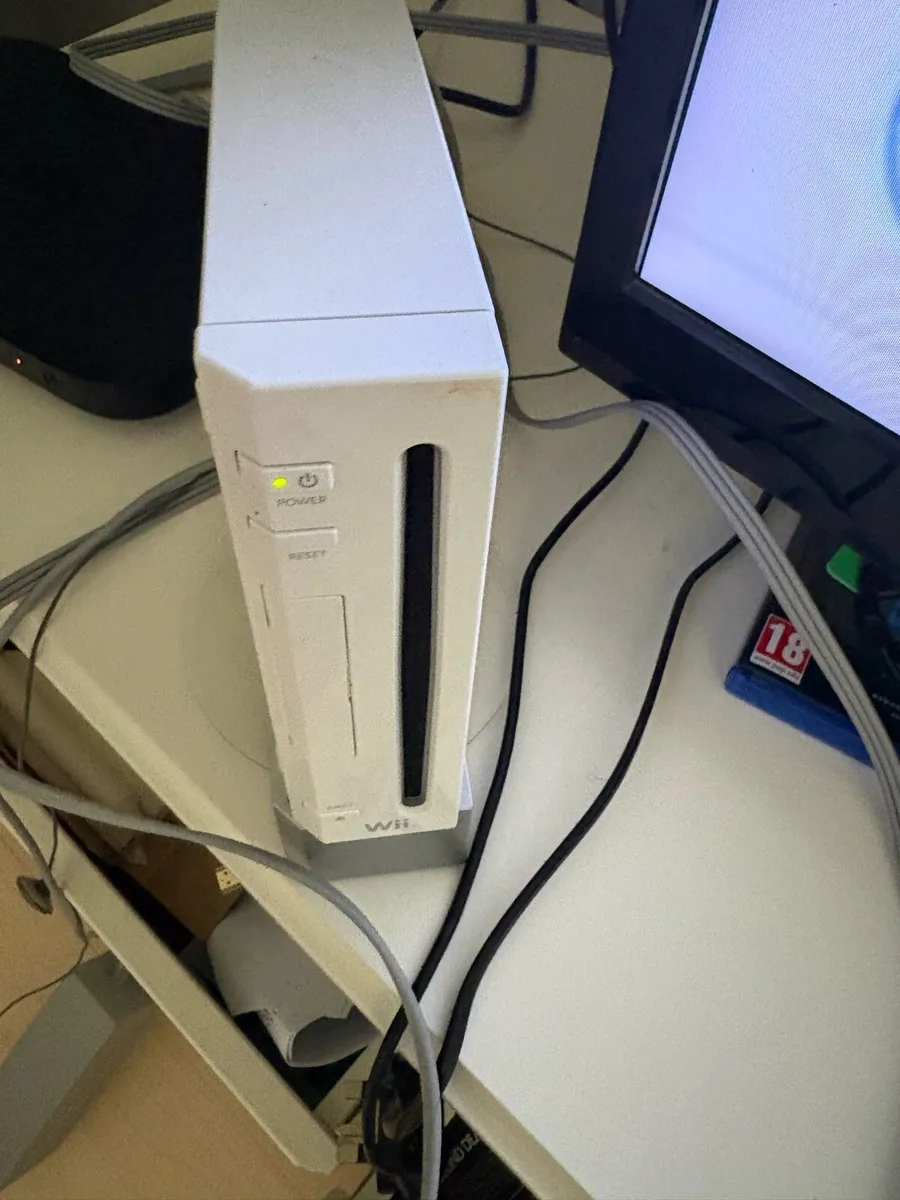 Wii console and games and kit pieces - Image 1