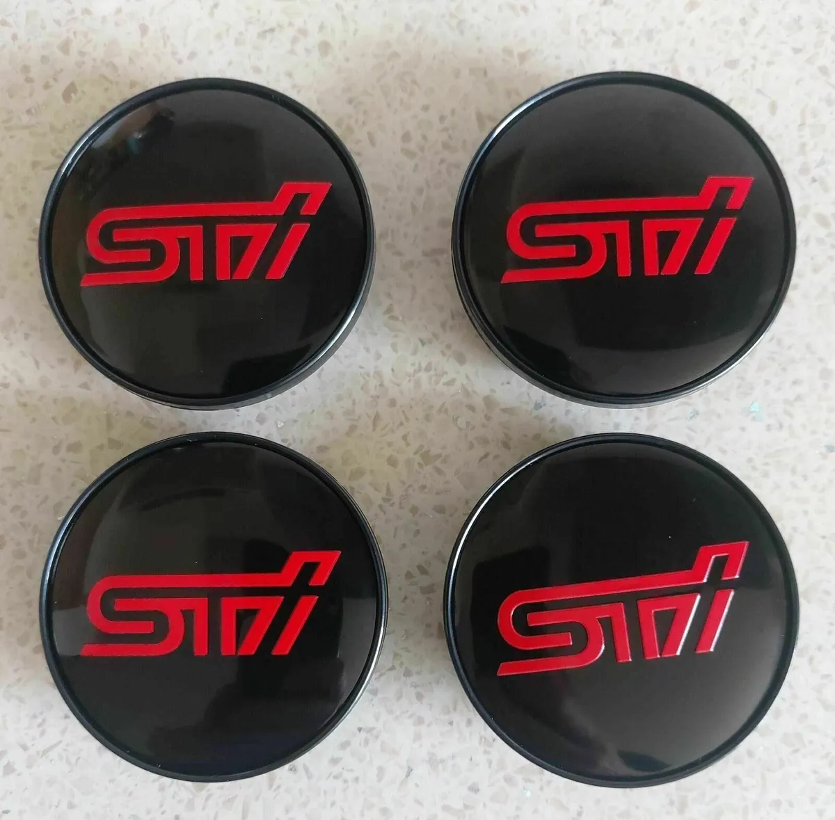 Subaru STI Centre Caps (59mm) FREE POST - Image 1