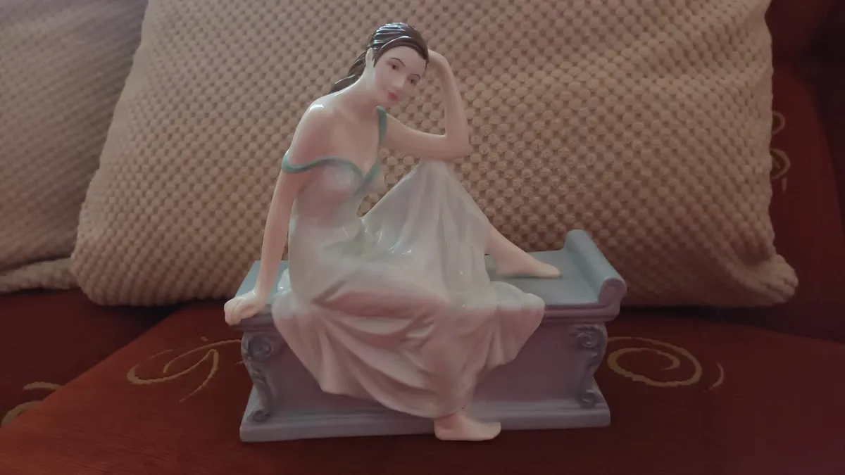Royal Doulton  Elegant Lady Seated on Bench - Image 1