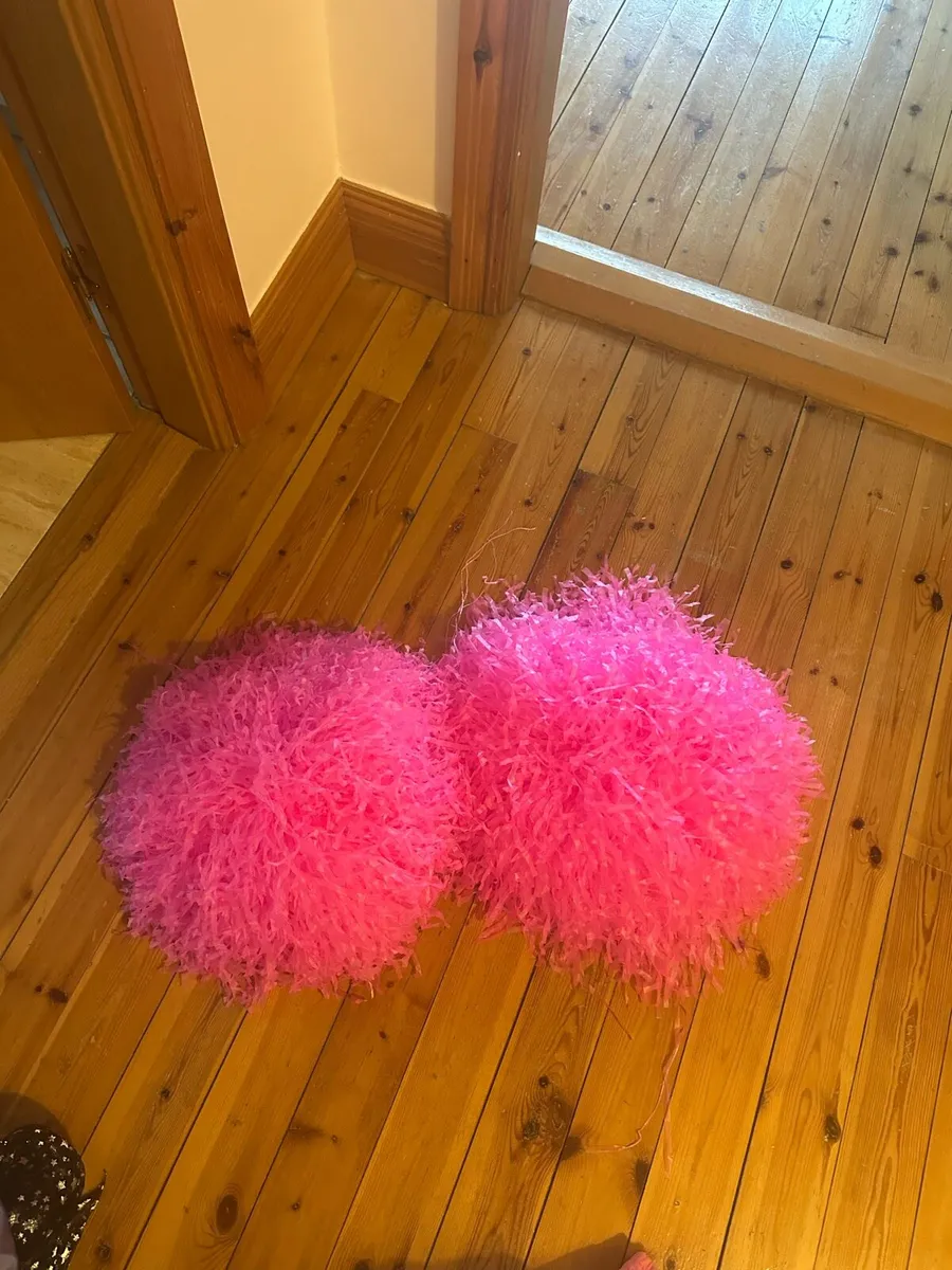 Girls cheerleading pom-poms