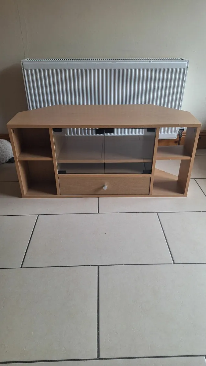 Wooden TV stand with glass doors and storage drawe - Image 1