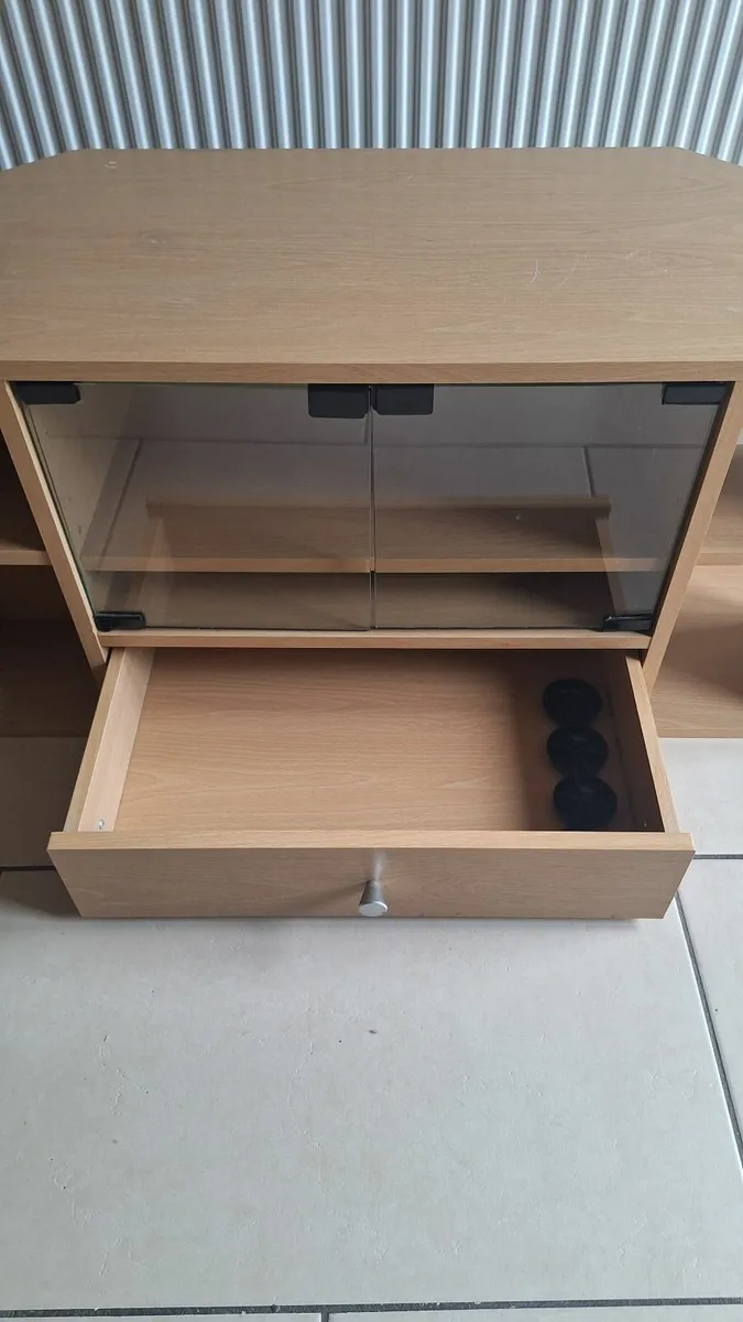 Wooden TV stand with glass doors and storage drawe - Image 3