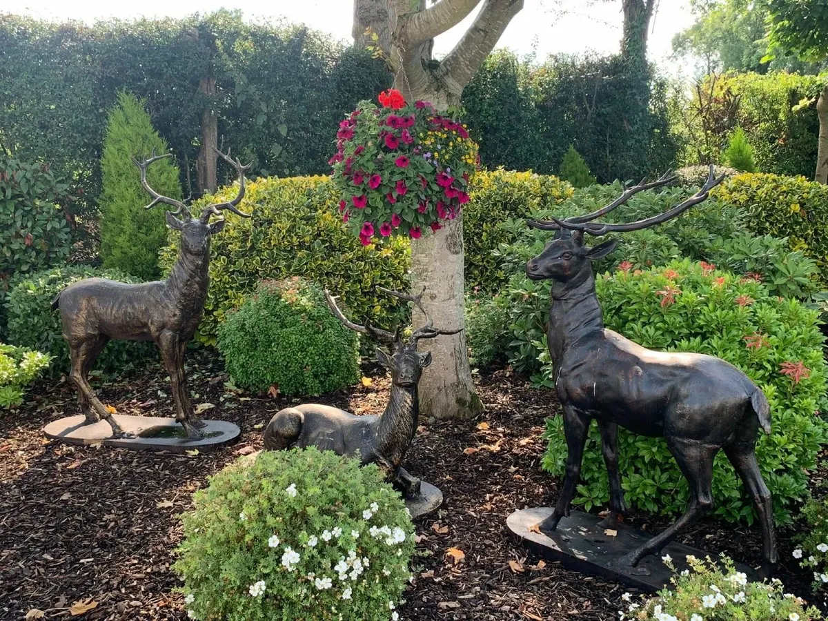 Pair of Cast Iron Standing & Laying Reindeer - Image 1