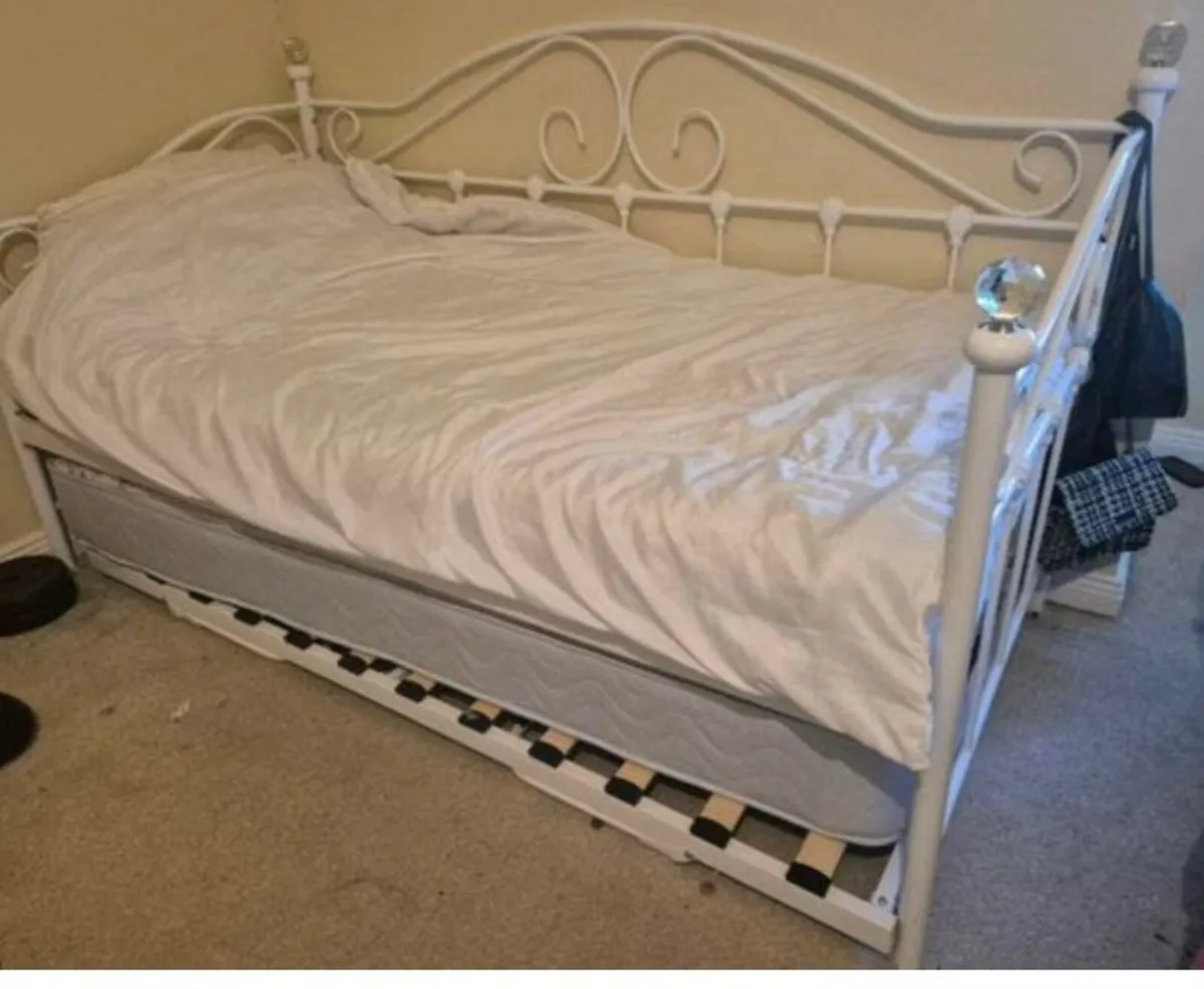 Single bed and trundle for sale.