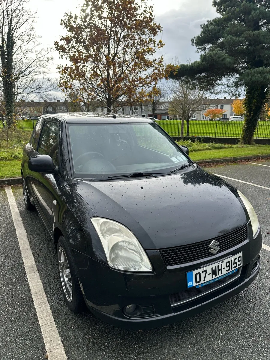Black 07 Suzuki swift - Image 1