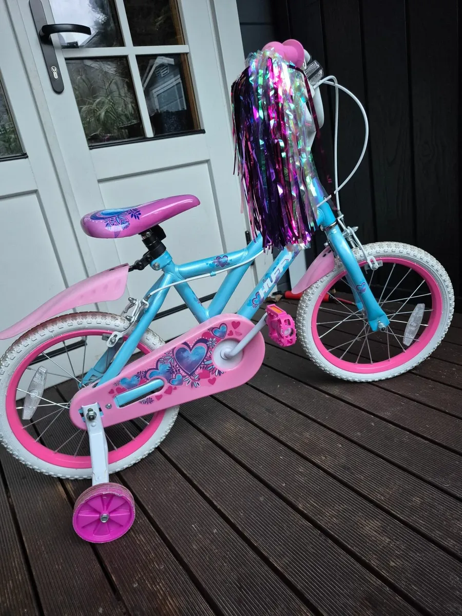 Girls huffy pink blue and pink bike - Image 1