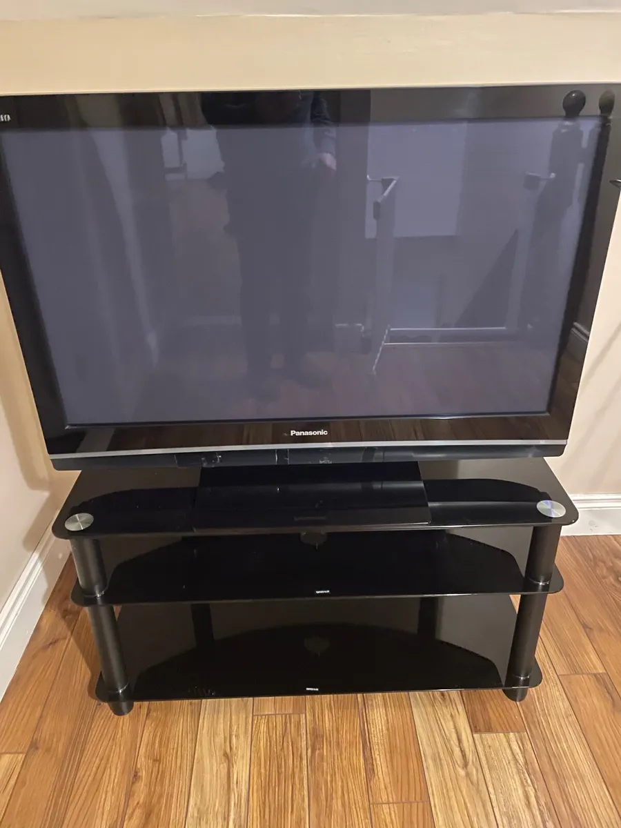 Television and stand - Image 1