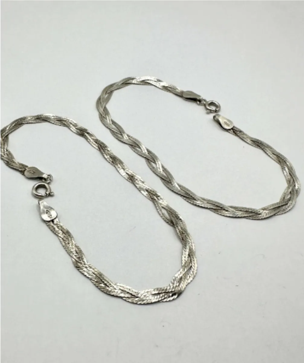 A Pair of Italian Sterling Silver Braided Bracelet - Image 1
