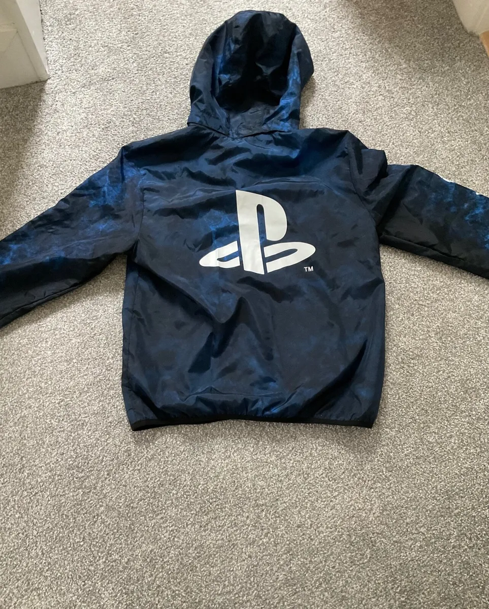 Boys raincoat, 12 to 14, brand new - Image 2