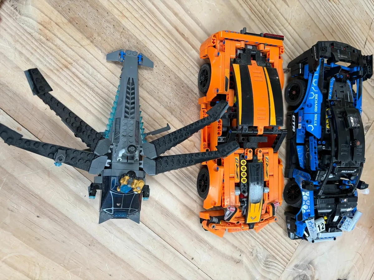 collection of Lego Technic cars and  Marvel Flyer