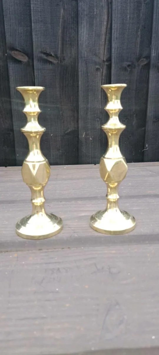 2 small  solid brass candle stick holders - Image 1