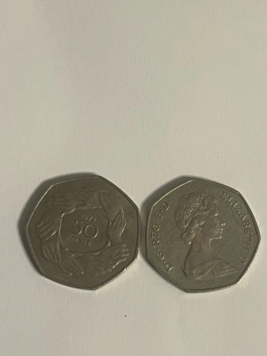 Fifty pence with hands